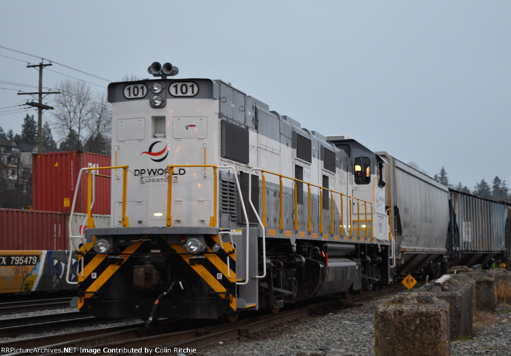 NREX 101 Genset pushing 25 loaded, covered hopper grain cars into the grain terminal, W/B in Brownsville.